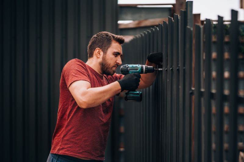 Local Black Metal Fence Installation pros at work